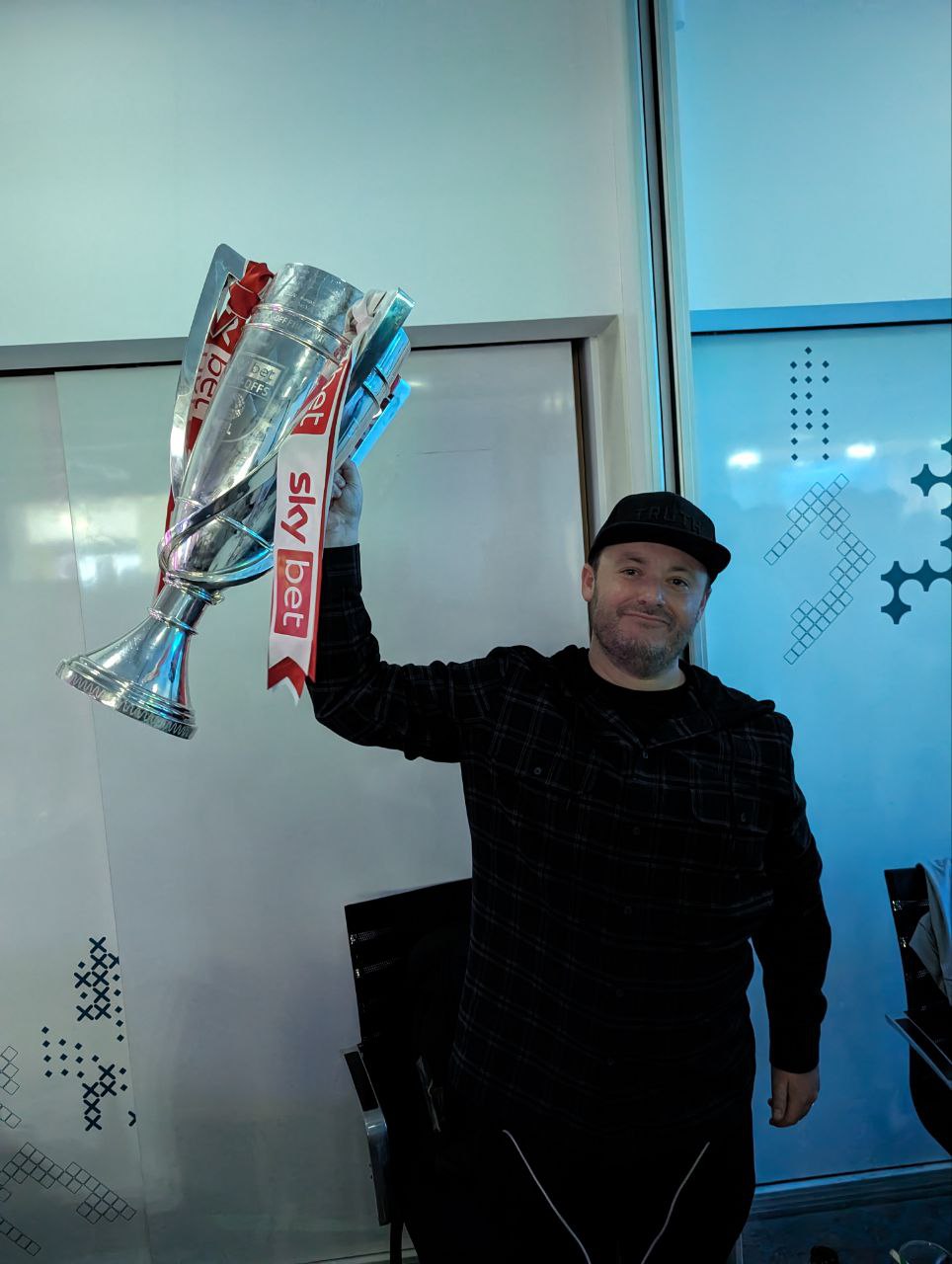 Sean Gearin holding the Sky Bet League Two Play-Off trophy at Wembley